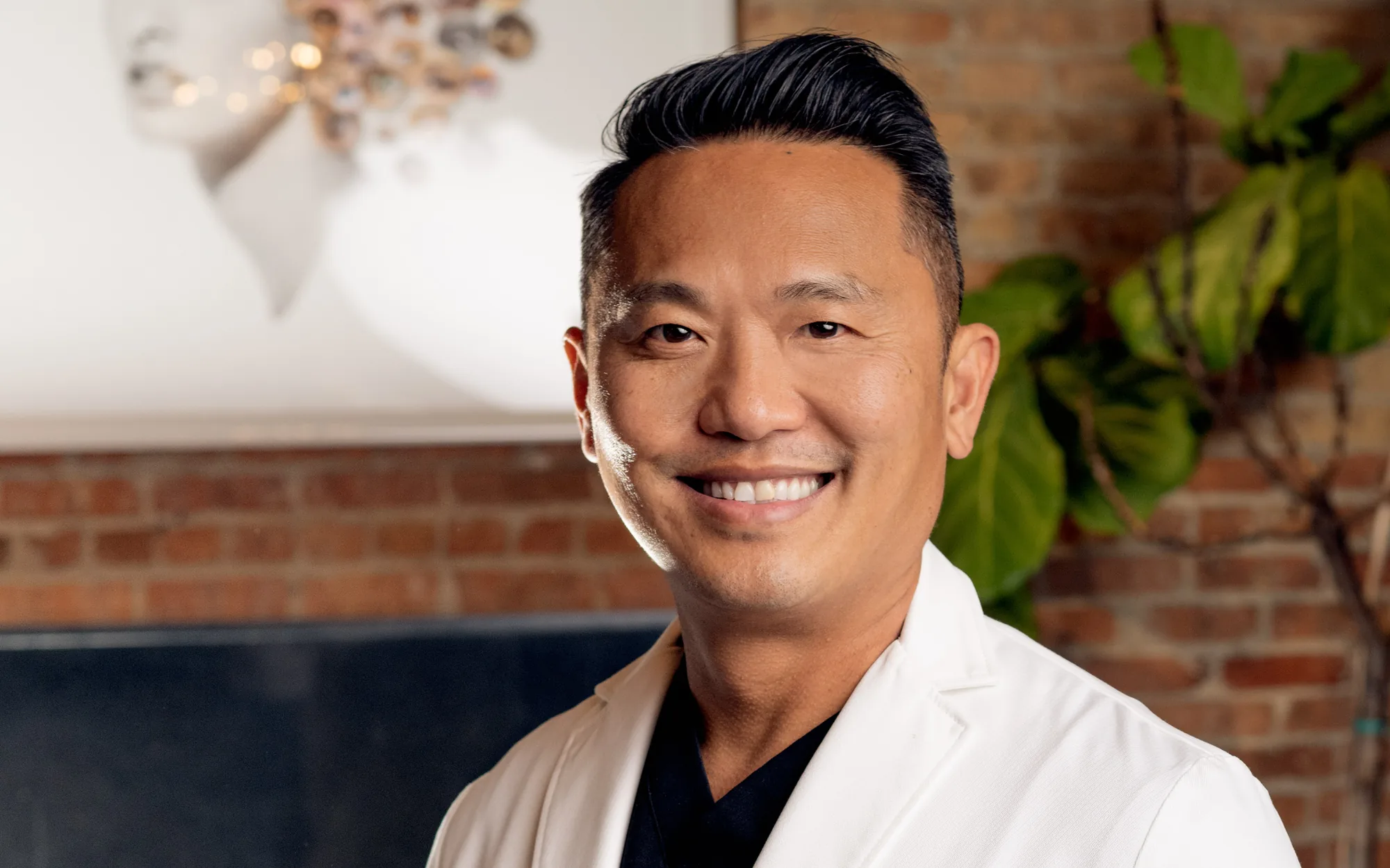 Dr. Anh-Tuan Truong, triple board-certified cosmetic surgeon, at FemSculpt in Chicago